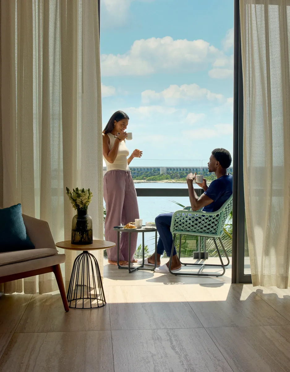 Couple in an Enclave suite at Hilton Tulum All-Inclusive