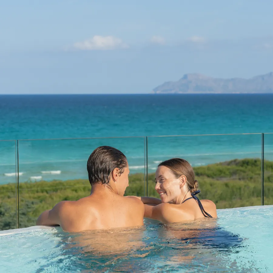 Couple in an infinity pool at an Iberostar resort