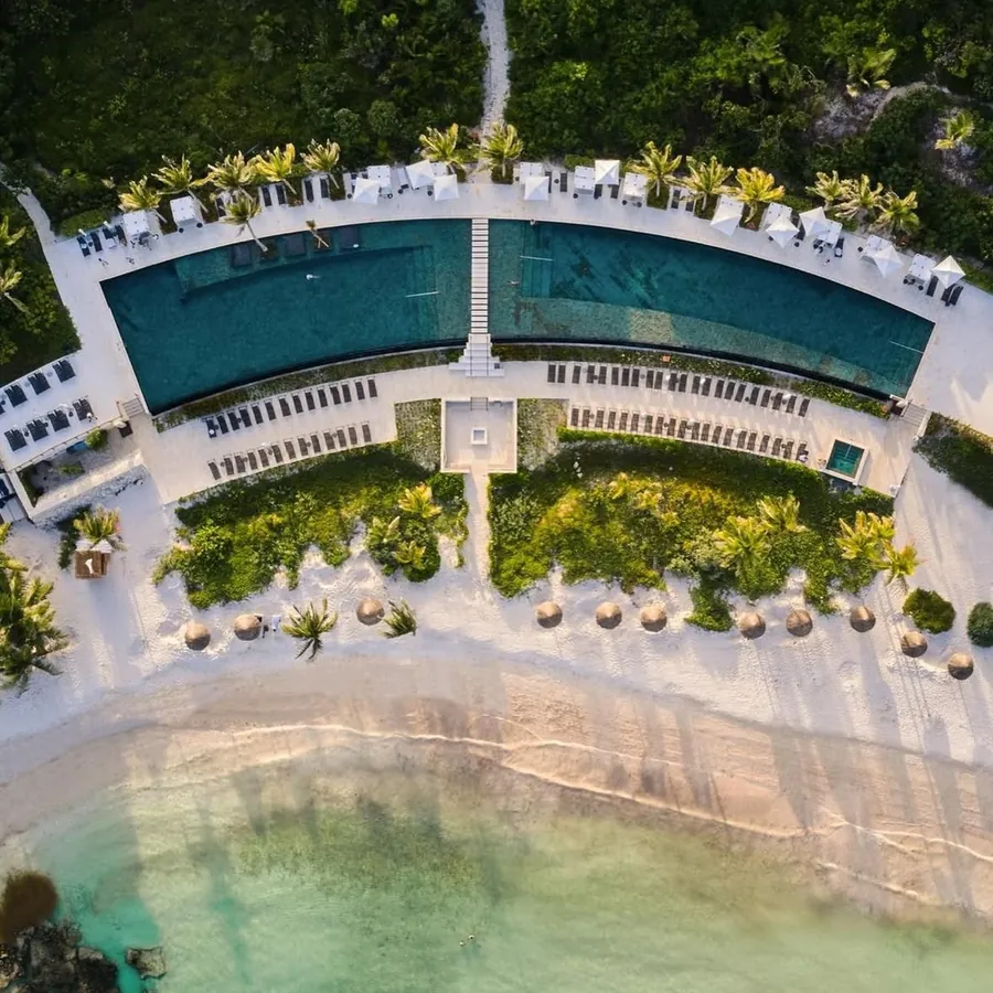 Aerial view of Conrad Tulum Riviera Maya on its secluded bay